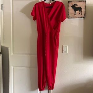 Red Jumpsuit. Never worn!!